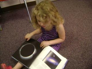 She likes this book for the eclipse and stars.