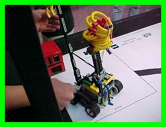 FLL Rover picking up food loops and delivering buildings