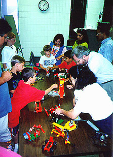 Parents enjoying the LEGO Campers' models on the final day.